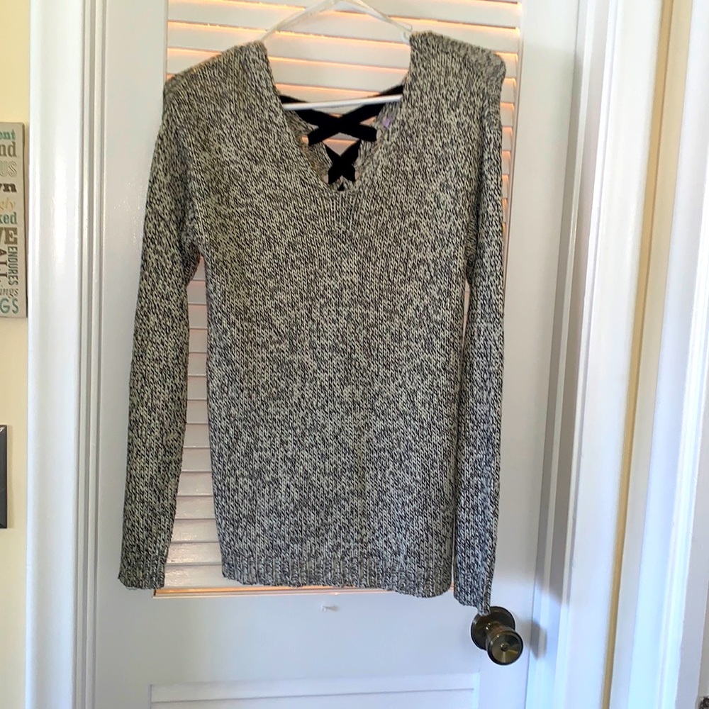 Alya beige & black sweater with black tie up in the back.